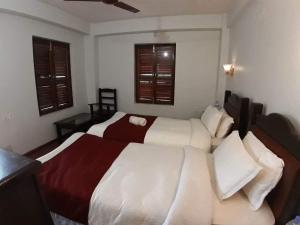 A bed or beds in a room at The Hotel