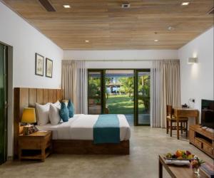 Postel nebo postele na pokoji v ubytování Regenta Arie Lagoon Negombo