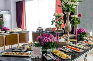 a buffet of food on a table in a hotel at Phoenicia Boutique Hotel - Adults Only in Mamaia Sat/Năvodari
