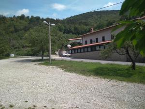 a street with a building and a street light at Gostišče Oddih in Solkan