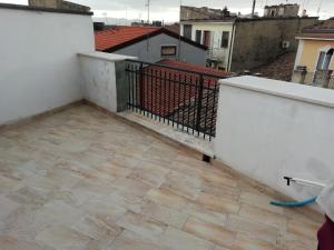 a balcony with a tile floor and a fence at B&B Belle Donne in Palazzo San Gervasio