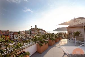a balcony of a hotel with a view of the city at The Sunset Suite Vernazza in Vernazza