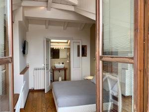 Postel nebo postele na pokoji v ubytování Porta Ronca - B&B, Suites & Apts