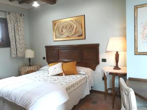 Tempat tidur dalam kamar di Tenuta Colverano