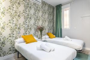 Ένα ή περισσότερα κρεβάτια σε δωμάτιο στο Waou Plaza de España II - Alquiler Corta Duración