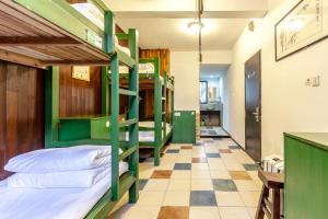 Postel nebo postele na pokoji v ubytování Hofang Guest House