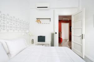 Voodi või voodid majutusasutuse Art in Athens Suite toas