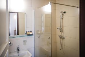 a bathroom with a shower and a sink at Villa Andor in Ankaran +35 photos