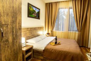 Кровать или кровати в номере Irmisa Hotel Tbilisi