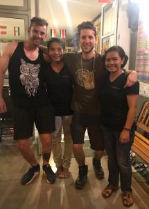 a group of people posing for a picture at Hub of Joys Hostel in Ko Lanta