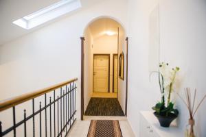 a hallway of a home with a yellow door at Villa Andor in Ankaran