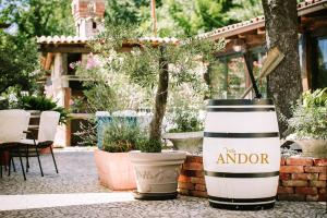 a couple of large drums sitting next to some plants at Villa Andor in Ankaran