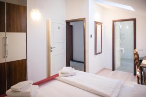 a bedroom with a bed with towels on it at Villa Andor in Ankaran