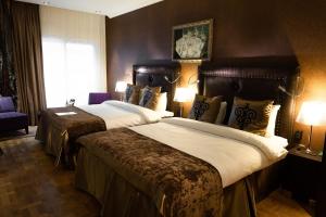Ліжко або ліжка в номері Clarion Collection Hotel Havnekontoret