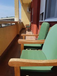 a row of chairs sitting on a balcony at Apartment Center in Čačak