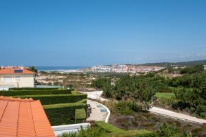 a view of a garden from the roof of a house at Magnifica Moradia V4 in Casal da Lagoa Seca
