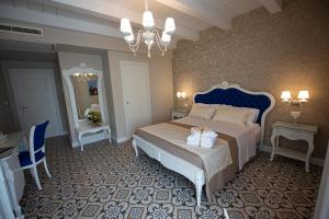 Voodi või voodid majutusasutuse Sui Generis Tropea Luxury Rooms toas