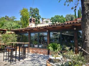 a house with a table and chairs in a garden at Villa Andor in Ankaran