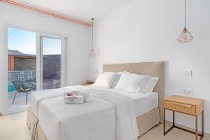 Posteľ alebo postele v izbe v ubytovaní Omnia Mykonos Boutique Hotel & Suites
