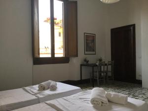 Posteľ alebo postele v izbe v ubytovaní Fortezza Third floor