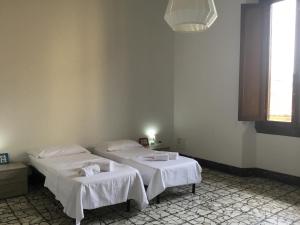 Posteľ alebo postele v izbe v ubytovaní Fortezza Third floor