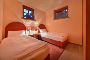Letto o letti in una camera di Chalet Matteo