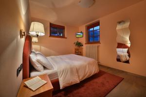 Letto o letti in una camera di Chalet Matteo