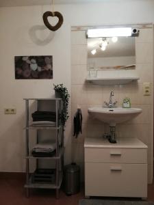 a bathroom with a sink and a mirror at Studio in Tulfes