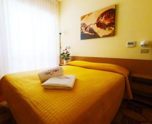 Postel nebo postele na pokoji v ubytování Hotel Milton