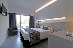 A bed or beds in a room at BG Pamplona Még 37 kép