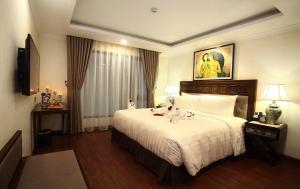 Giường trong phòng chung tại Paris Boutique Hotel Sapa