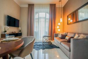 Televízia a/alebo spoločenská miestnosť v ubytovaní Bengt Apartment Dohány Str.