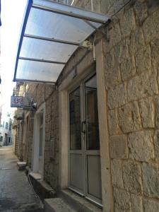 awning over a door on a brick building at Apartment Dea in Split