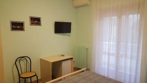 TV a/nebo společenská místnost v ubytování Villa Erry