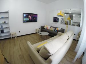 a living room with a couch and a table at Casa Marinin in Sestri Levante