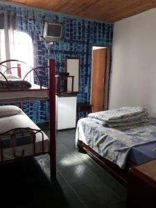 Katil atau katil-katil dalam bilik di Pousada Mirante das Pedras