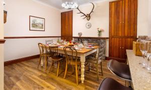 a dining room with a table and chairs at Highfield House in Ambleside