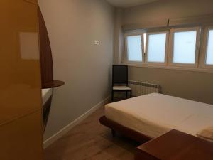 A bed or beds in a room at San Juan by Basquelidays