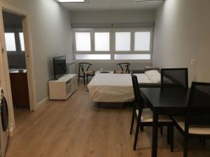 A bed or beds in a room at San Juan by Basquelidays