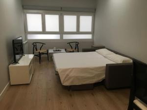 A bed or beds in a room at San Juan by Basquelidays