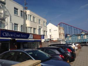 a row of cars parked in a parking lot at Clifton Court Hotel in Blackpool