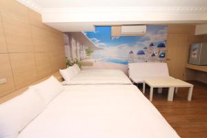A bed or beds in a room at Sea Keelung 61