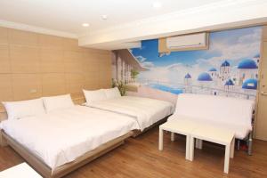 A bed or beds in a room at Sea Keelung 61