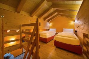 Postel nebo postele na pokoji v ubytování Chalet Matteo