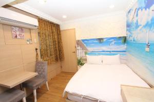 A bed or beds in a room at Sea Keelung 61