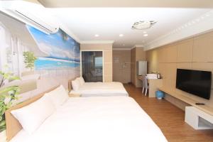 A bed or beds in a room at Sea Keelung 61