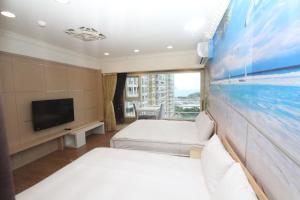 A bed or beds in a room at Sea Keelung 61
