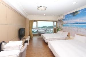 A bed or beds in a room at Sea Keelung 61