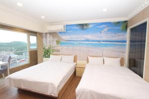 A bed or beds in a room at Sea Keelung 61