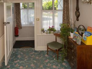 a room with a desk and a chair and a window at Eypeleaze B&B in Bridport